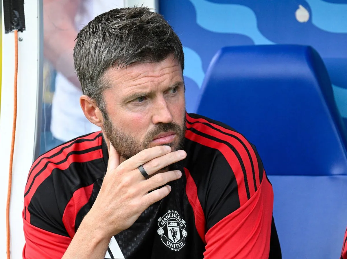 Manchester United's English head coach Michael Carrick sits on the bench during the pre-season friendly match between English Premier League football club Manchester United and EFL Championship club Wrexham AFC at Helsinki Olympic Stadium in Helsinki, Finland on July 18, 2026. (Photo by Markku Ulander / Lehtikuva / AFP via Getty Images) / Finland OUT