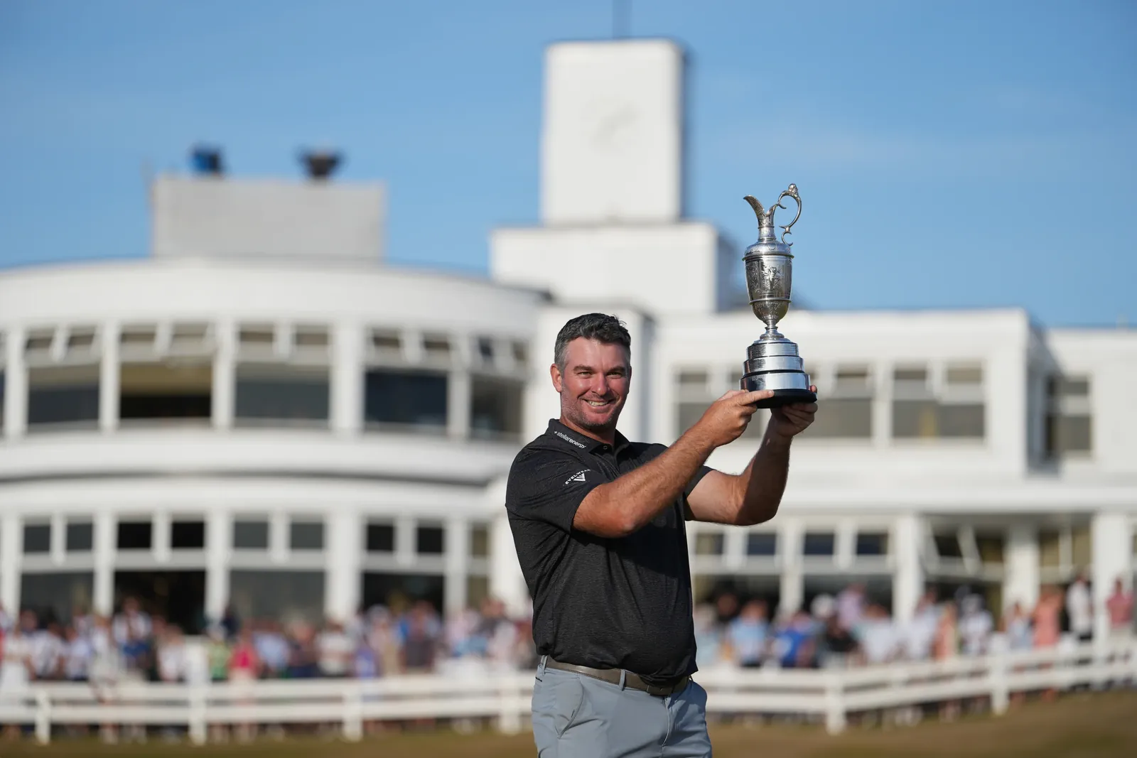 Ryan Fox of New Zealand poses with the Claret Jug trophy in front of the club house, after winning the British Open Golf championships at Royal Birkdale golf club, in Southport, England, Sunday, July 19, 2026. (AP Photo/Jon Super)