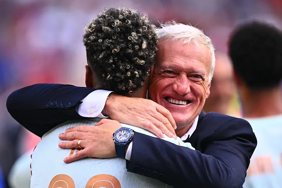 France coach Didier Deschamps (R) hugs France's Desire Doue after winning the 2026 FIFA World Cup quarter-final match against Morocco at Boston Stadium. Tom Weller/dpa