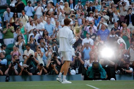Sinner celebrates with the trophy.